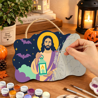 Pancarte Christ à la Lanterne en cours de peinture, pinceau à la main — Maison Artsen