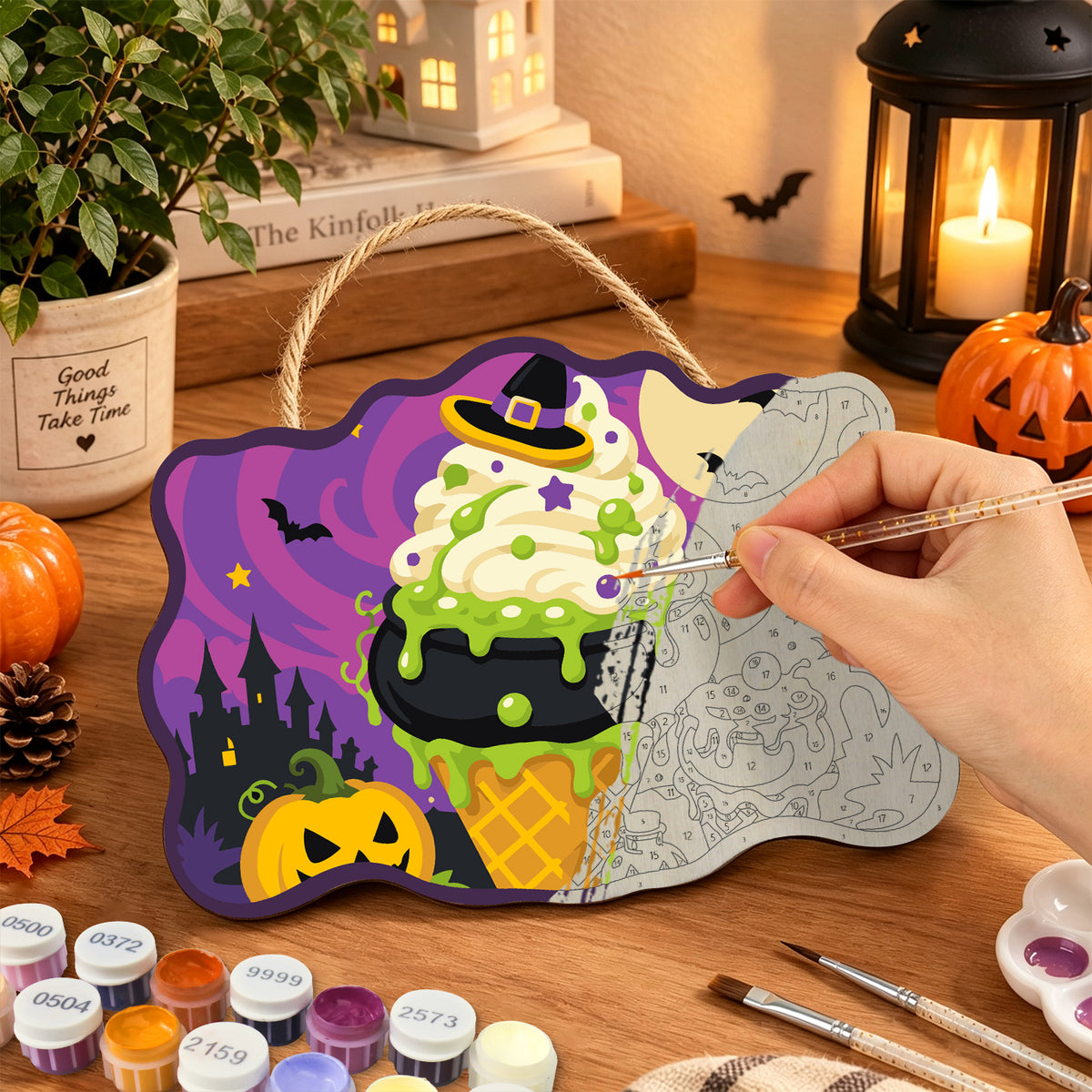 Pancarte Glace Chaudron de Sorcière en cours de peinture, pinceau à la main — Maison Artsen