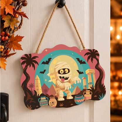 Pancarte Momie des Pyramides peinte et accrochée à une porte d'entrée décorée pour Halloween — Maison Artsen