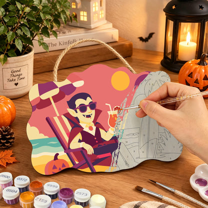 Pancarte Vampire en Transat en cours de peinture, pinceau à la main — Maison Artsen